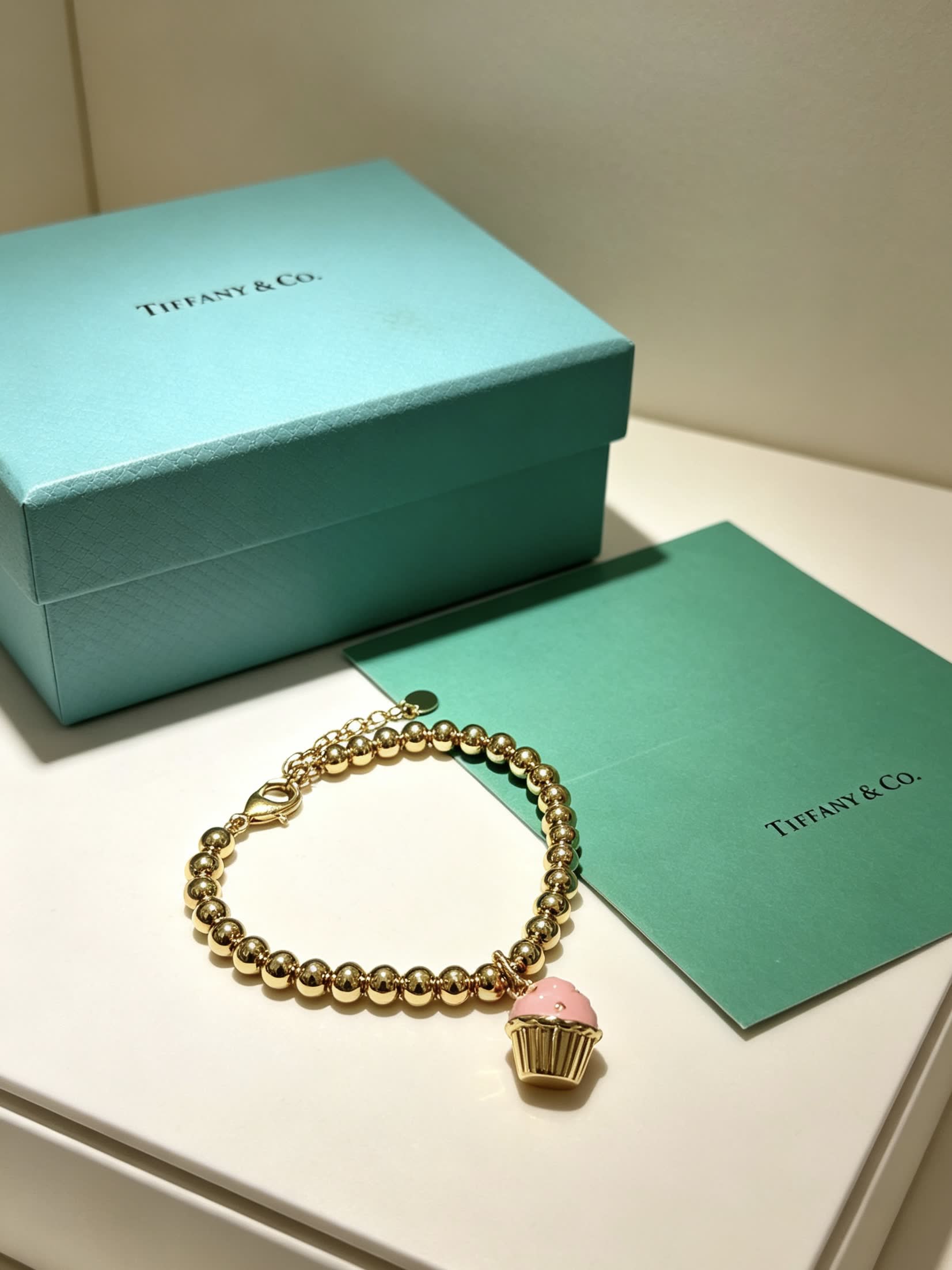 Tiffany & Co. Gold Bead Bracelet with Cupcake Charm
